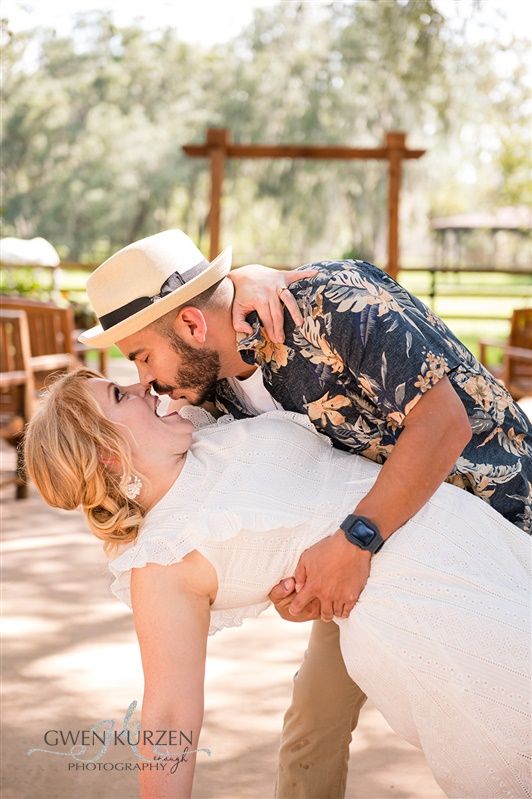 Funny-Faced-Pose-Dipping-Future-Bride-Backwards-Infront-of-Pasture