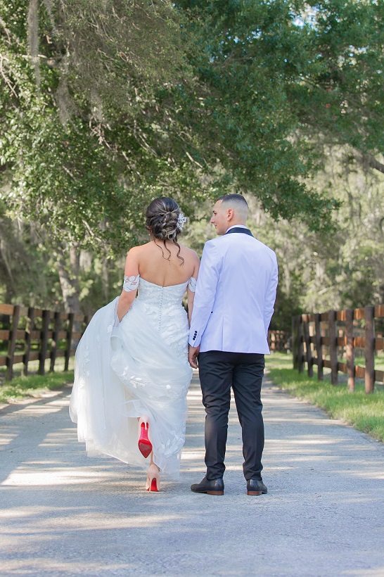 The-Backside-Of-the-Bride-and-Groom-Walking-Away