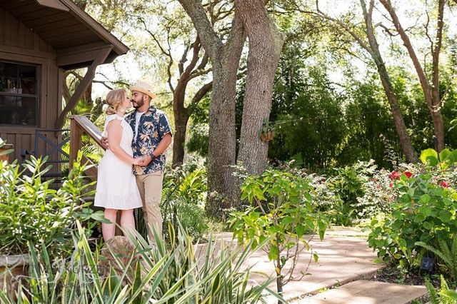 Engaged-Couple-Posing-on-the-Cabin-Porch