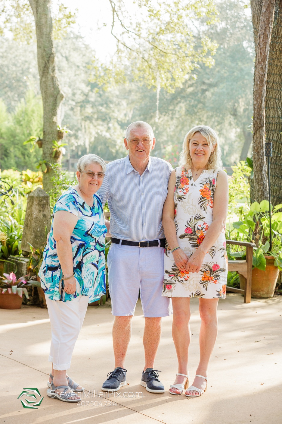 Family of the couple posing for a picture outdoors for this memorable anniversary shoot