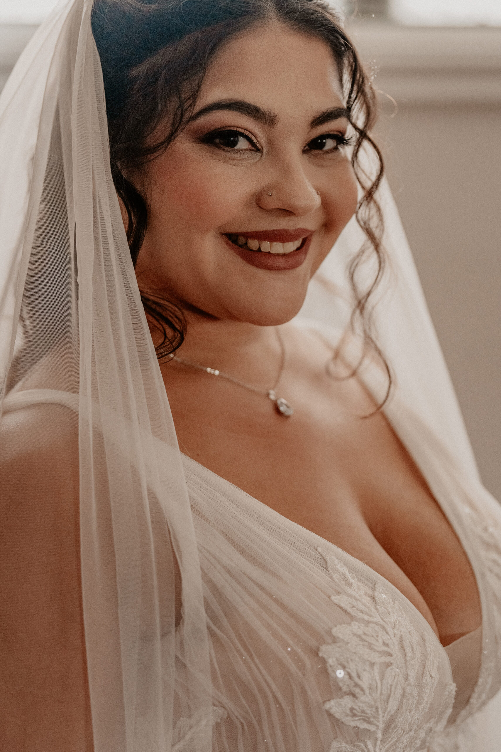 Bride looking stunningly beautiful looking straight at the camera